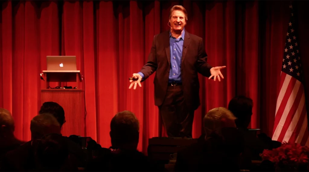 Captivating Moment: Dan Gordon in Action, Engaging the Audience